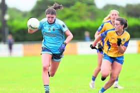 Grace Shannon surging forward for Slashers ahead of Carrickedmond opponent Ciara Mulligan. Action from the Ladies SFC semi-final on Sunday Photo: Syl Healy