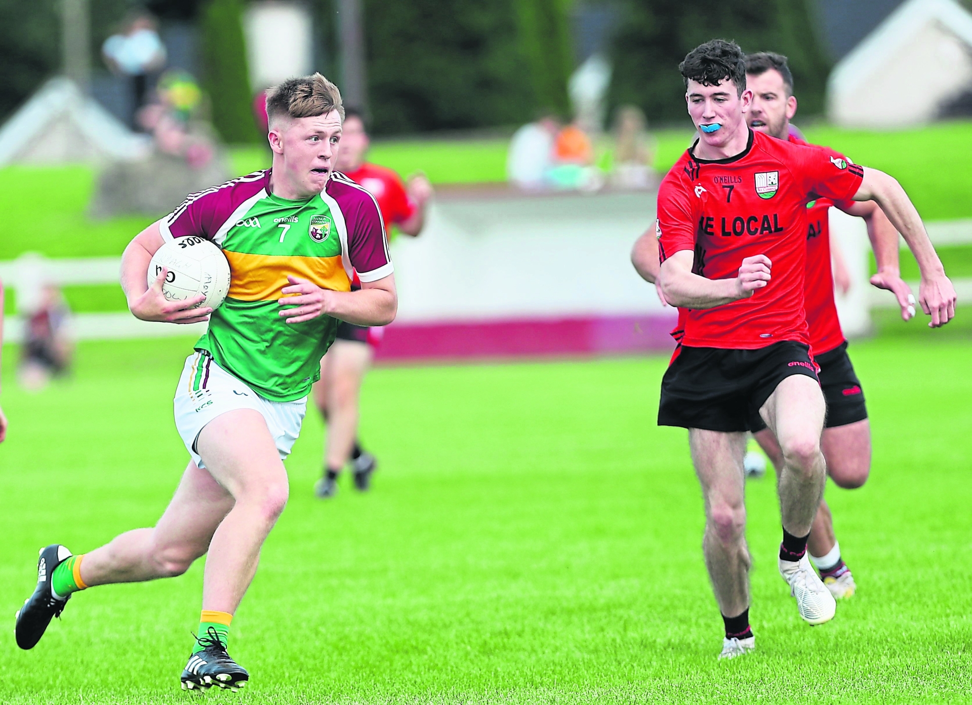 Elliott Vaughan surging forward for Ardagh Moydow with Cashel opponent Jack Sweeney in pursuit. Action from the IFC Round 6 clash at Leo Casey Park Photo: Syl Healy