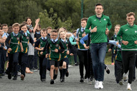 Mark English and Sean McGinley lead the Glenswilly NS athletes on a lap of their new track. Photos: Thomas Gallagher