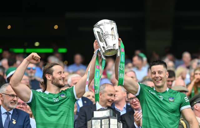 Brothers in (giant) arms: Tom and Dan Morrissey with Liam MacCarthy in Croke Park after this year’s All-Ireland final | PICTURES: Sportsfile