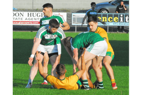 Shane Moran (on the ground) is tackled by two Mohill opponents on Friday evening Picture: Willie Donnellan