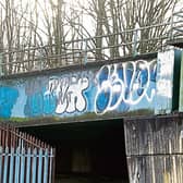 Grafitti has been sprayed on the railway bridge at Childers Road