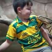 Zack Hennessy, 10, gets face to face with one of the world's largest lizards - Bam Bam the Asian Water Monitor.