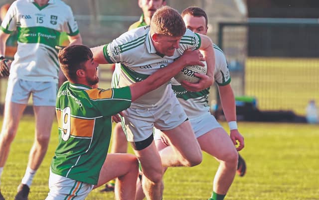 Castlemitchell Emmet Hyland is tackled by Kildangan's Daniel Gilbert in the JFC round 4 clash on Thursday in Hawkfield