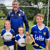 Paschal Ryan, centre, with some younger members of Ballinhassig GAA club