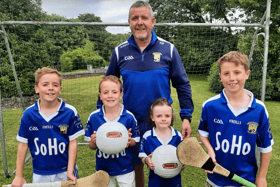 Paschal Ryan, centre, with some younger members of Ballinhassig GAA club