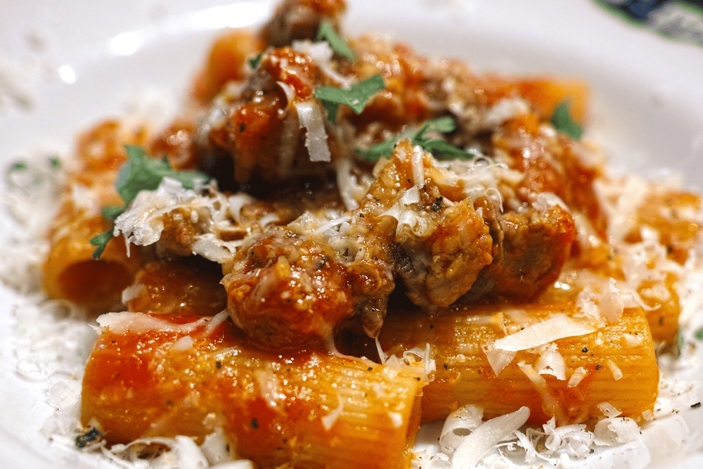 The word rigatoni comes from the Italian word rigato  which means ridged or lined, and is associated with the cuisine of southern and central Italy