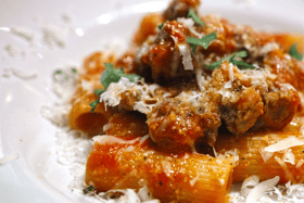 The word rigatoni comes from the Italian word rigato  which means ridged or lined, and is associated with the cuisine of southern and central Italy