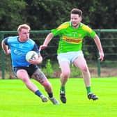 Athgarvan Cillian Smith side steps Kildangan Adam Carroll in the Tom Cross Transport JFC. Photo: Sean Brilly