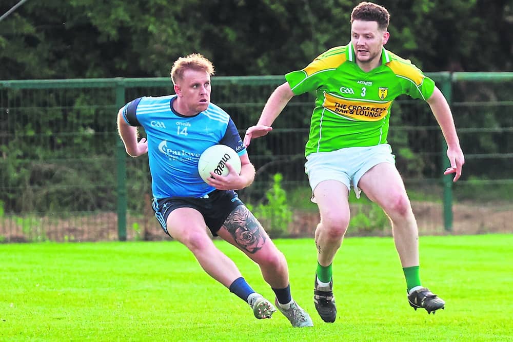 Athgarvan Cillian Smith side steps Kildangan Adam Carroll in the Tom Cross Transport JFC. Photo: Sean Brilly