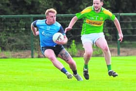 Athgarvan Cillian Smith side steps Kildangan Adam Carroll in the Tom Cross Transport JFC. Photo: Sean Brilly