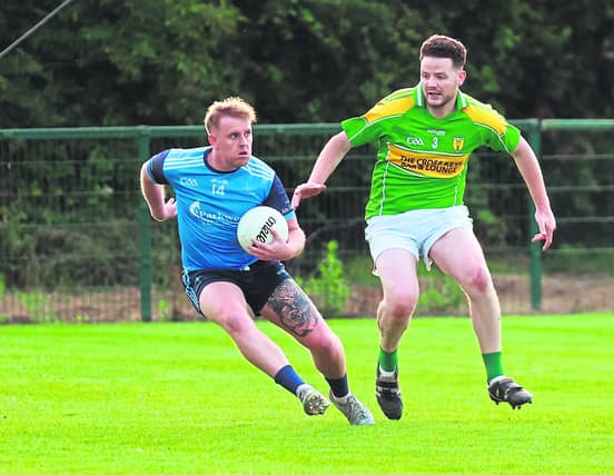 Athgarvan Cillian Smith side steps Kildangan Adam Carroll in the Tom Cross Transport JFC. Photo: Sean Brilly