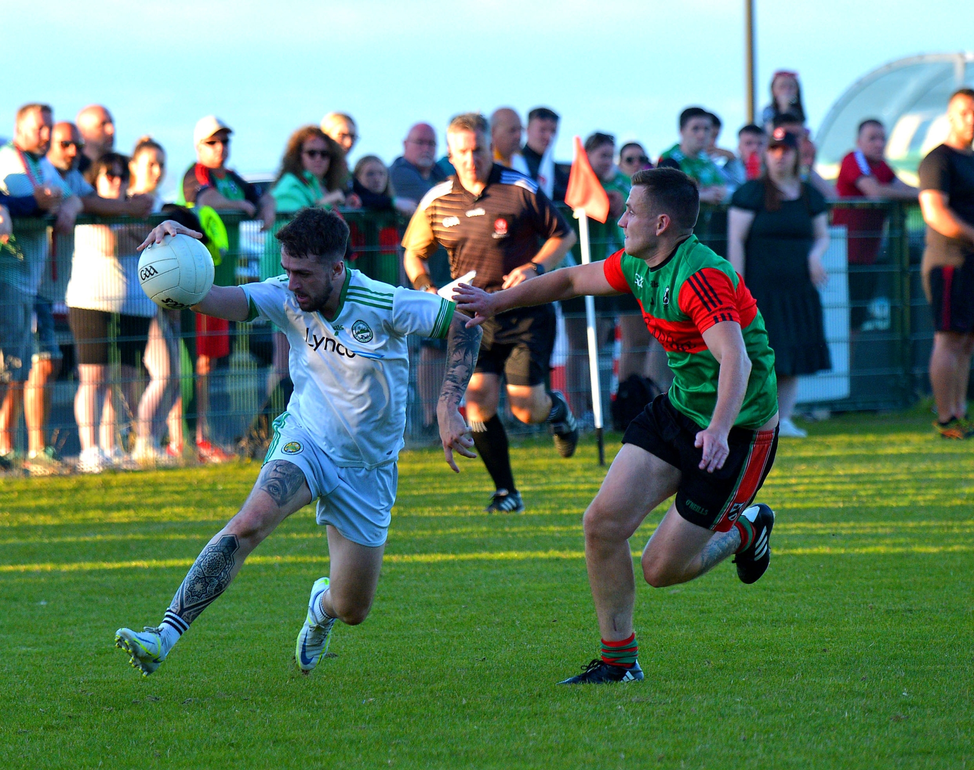 Craigbane’s Cahir O’Kane under pressure from Trasna’s Tomas McCrossan.