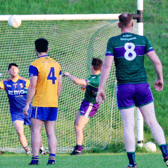 Leitrim Gaels Shaun Chandler lifts the ball over Glencar Manor keeper Anthony McDonald Picture: James Molloy