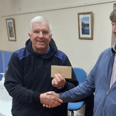 Patrick Kenny - from Shannon Harbour Community Development Committee presenting Ollie Doyle with first prize in the annual classic match.