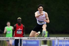 Fintan Dewhirst in action last month at the 400m hurdles at the Ulster underage championships at the Antrim Forum