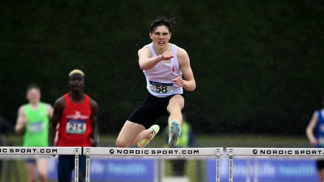 Fintan Dewhirst in action last month at the 400m hurdles at the Ulster underage championships at the Antrim Forum