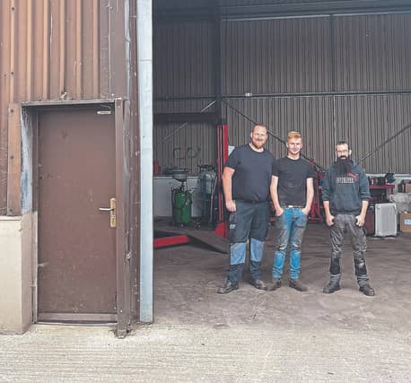Rory Browne, Paul Dollery and Sean Connaughton in their new garage