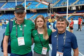 Lucy McGlynn with her coach Eamon Harvey and Finn Valley AC's Neil Martin, who is the Irish Team Leader in Colombia.