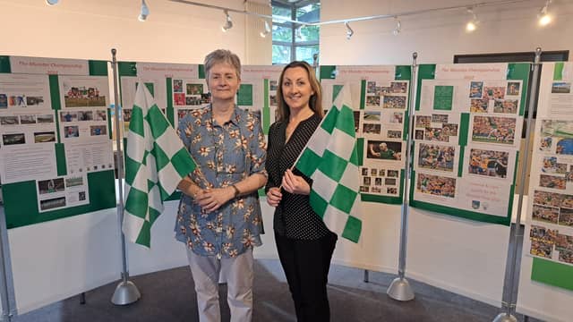 Limerick librarians Deirdre Kelly and Ciara Barry celebrate Limerick's win in front of the 2022 Road to Croke Park exhibition