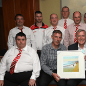 Lochlainn McCool, chairman, Culdaff FC presents a framed painting to special guest, Former Irish international goalkeeper Packie Bonner at the Culdaff FC 50th anniversary dinner.  Photos: Tom Heaney