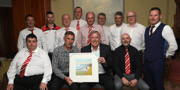 Lochlainn McCool, chairman, Culdaff FC presents a framed painting to special guest, Former Irish international goalkeeper Packie Bonner at the Culdaff FC 50th anniversary dinner.  Photos: Tom Heaney