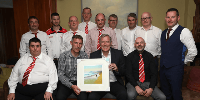 Lochlainn McCool, chairman, Culdaff FC presents a framed painting to special guest, Former Irish international goalkeeper Packie Bonner at the Culdaff FC 50th anniversary dinner. Photos: Tom Heaney