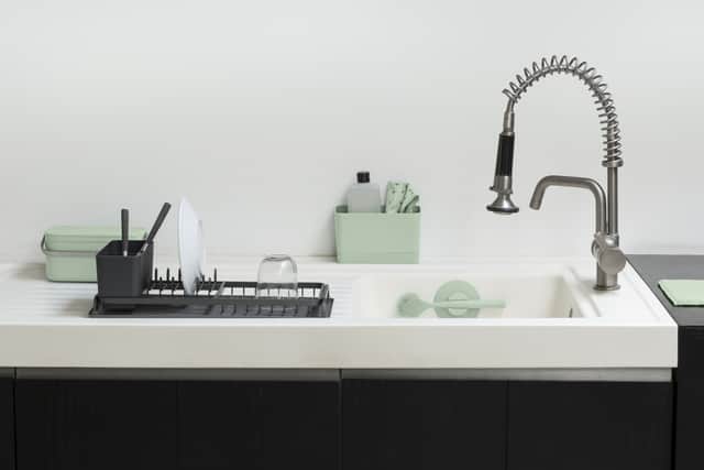 1. Brabantia Dish Brush with Suction Cap Holder – Jade Green, £9.50; Sink Organiser – Jade Green, £14.95; Food Waste Caddy – Jade Green, £22.95, and Compact Dish Drying Rack – Dark Grey, £39.95, Brabantia
