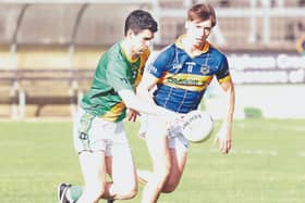 Kill Kevin Corrigan drives forward despite the chasing Oran Bergin Grange in the Top Cross JFC Round 1 game at Hawkfield. Photo: Sean Brilly