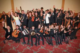 Music Generation Trad musicians from Laois and Waterford with Minister Norma Foley, Adam Clayton, Music Generation National Director Rosaleen M Rosaleen Molloy.   Photo: Credit Aengus McMahon