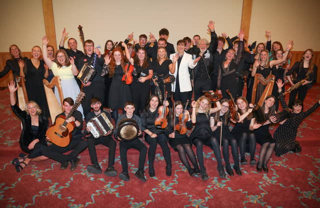Music Generation Trad musicians from Laois and Waterford with Minister Norma Foley, Adam Clayton, Music Generation National Director Rosaleen M Rosaleen Molloy. Photo: Credit Aengus McMahon
