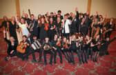 Music Generation Trad musicians from Laois and Waterford with Minister Norma Foley, Adam Clayton, Music Generation National Director Rosaleen M Rosaleen Molloy.   Photo: Credit Aengus McMahon