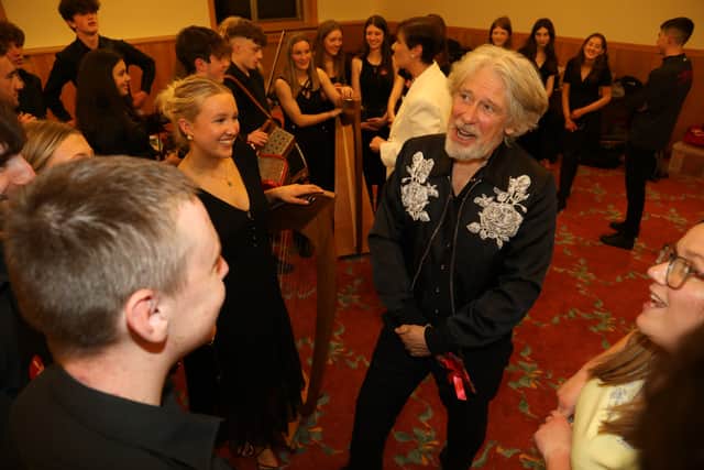 U2 bass player Adam Clayton met some of the musicians. MORE BELOW PICTURE OF HIM MEETING THE LAOIS MUSICIANS.