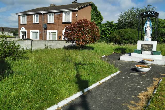 Below, the shrine as it appeared before the grass cutting and clean-up