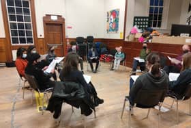 The cast busy at rehearsals
