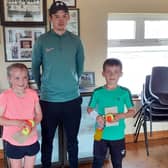 Under 10 finalists Anna Lyons & Conor Mullins with coach Dermot Shiels.