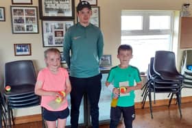 Under 10 finalists Anna Lyons & Conor Mullins with coach Dermot Shiels.