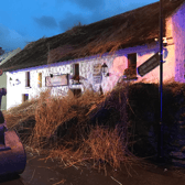 Larkins in Garrykennedy with part of the thatched roof that was removed to tackled a fire at the premises this Friday