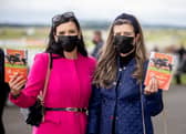 Two racegoers wearing face masks during Covid-19 restrictions at the Irish Derby in 2021 PHOTO: curragh.ie