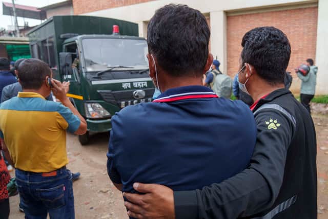 While 10 bodies were flown to Kathmandu on Monday, the remaining were brought by army helicopter on Tuesday. Relatives of the crash victims waited outside the hospital building for authorities to release the bodies.