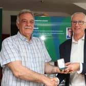 Inishowen teacher Patsy Toland receiving his award