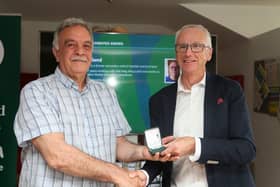 Inishowen teacher Patsy Toland receiving his award