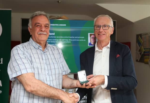 Inishowen teacher Patsy Toland receiving his award