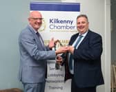 Outgoing President of Kilkenny Chamber Colin Ahern hands over the Chain of Office to incoming President Brian Keyes Photo: Vicky Comerford