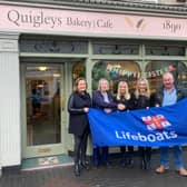RNLI lifeboat fundraising committee at the launch with sponsors Gillian O'Connor and Niamh O'Connor, Quigleys Bakery