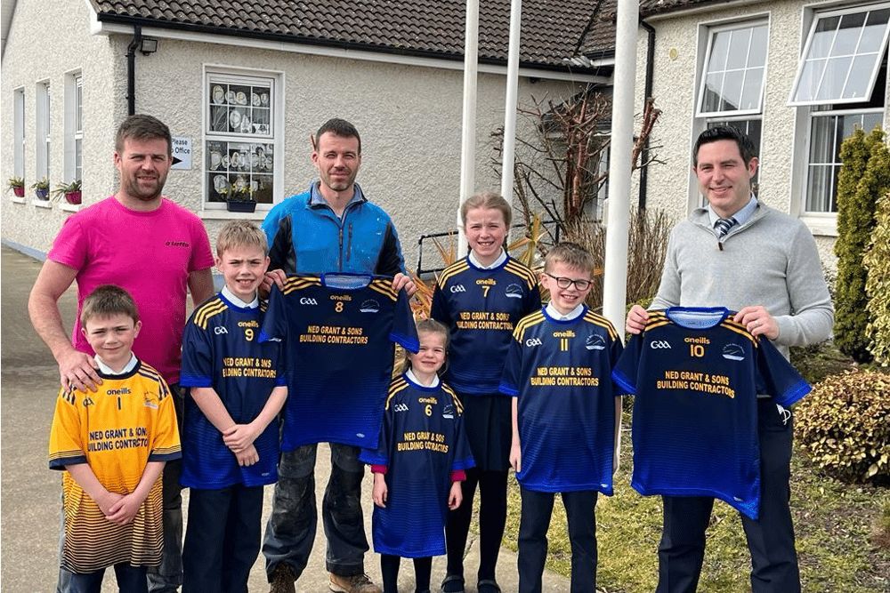 Martin and Stephen Grant, presenting a new set of jerseys to Ballylooby National School principal, Kieran Scanlon, which were kindly sponsored by Ned and Rita Grant, who have five grandchildren attend