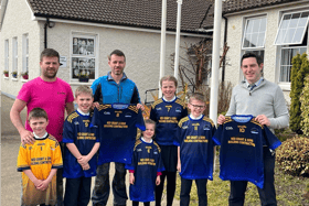 Martin and Stephen Grant, presenting a new set of jerseys to Ballylooby National School principal, Kieran Scanlon, which were kindly sponsored by Ned and Rita Grant, who have five grandchildren attend