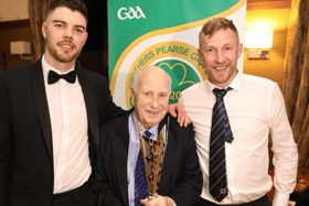 Tom Milne (centre) is pictured with his award alongside current Brothers Pearse players, Galway man Pauric Muldoon (left) and Limerick's Stephen Frawley