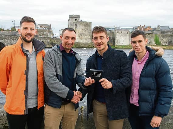 Pat Ryan ‘Simon’ and Barry Murphy, of TrackNow, present a safety tracking device to Barry Lenahan and Shane Crotty, Limerick Suicide Watch |PICTURE: Adrian Butler
