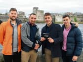 Pat Ryan ‘Simon’ and Barry Murphy, of TrackNow, present a safety tracking device to Barry Lenahan and Shane Crotty, Limerick Suicide Watch |PICTURE:  Adrian Butler